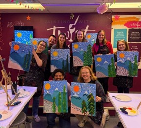 Image of people with paintings
